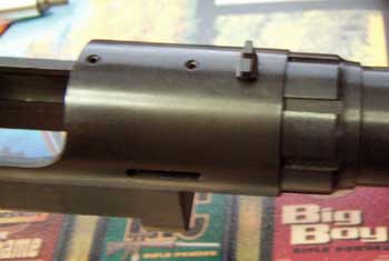 Rear sight is non-adjustable and attached to the action with a screw.