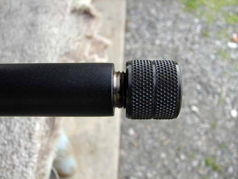 This particular example is suppressor ready with a 1/2-20TPI threaded muzzle.  This is not a standard feature for this model, so you likely won't find it on the ones at your local gun shop.