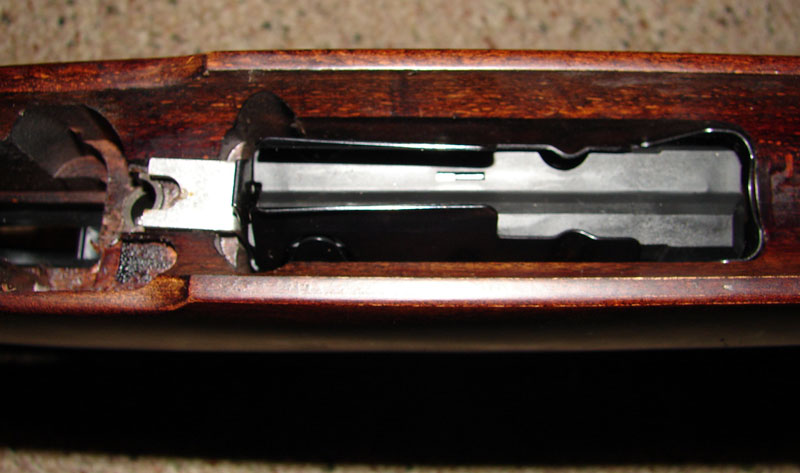 New center-feed magazine.  Note the small bracket to the rear which serves two purposes:  setting the height of the rear of the magazine box and applying tension to keep the front of the magazine box on it's lip.