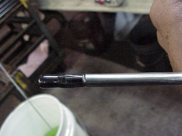 A rifling button is pulled through the bore of the barrel blank, which cuts the grooves of the rifling.
