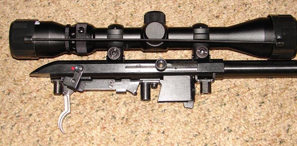 Side view of action showing the trigger assembly and magazine well arrangement.