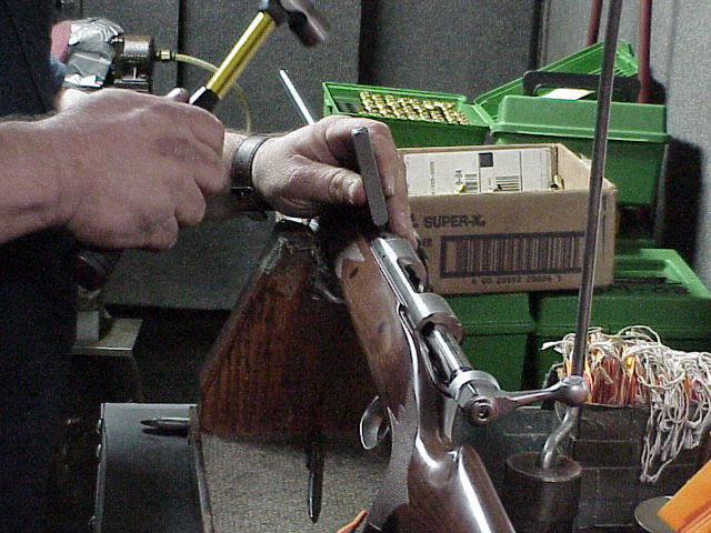 Inspector's stamp being applied after the rifle is completely assembled and function fired.